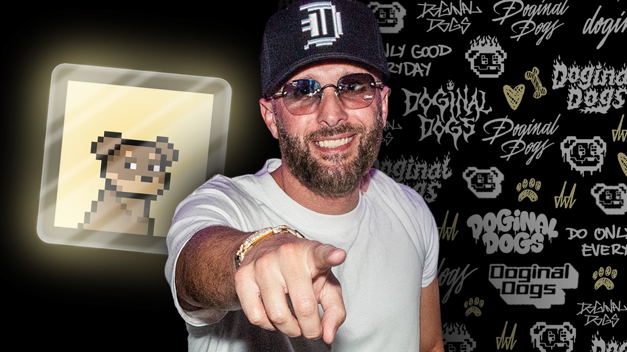 Bearded community member in a DD cap pointing beside a framed pixel dog