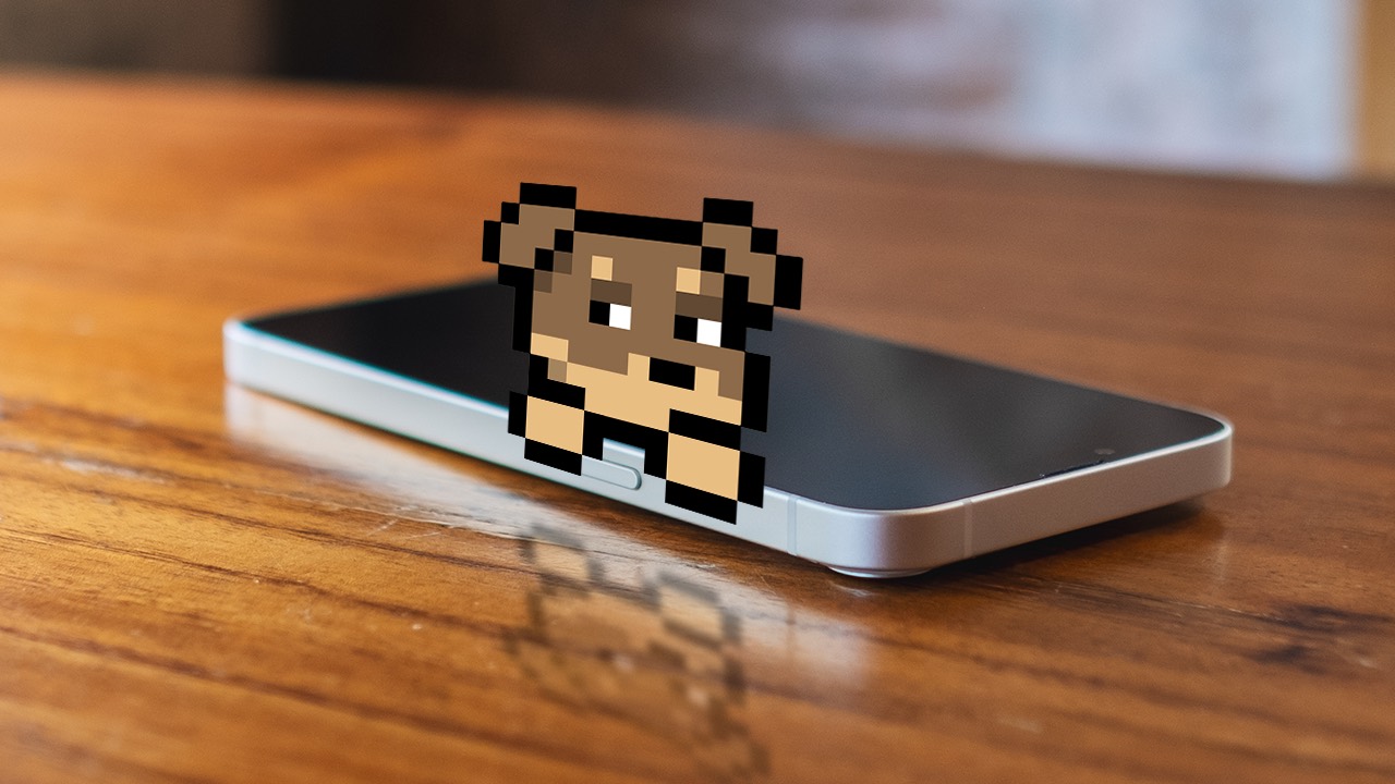 Doginal Dogs pixel NFT sitting on a smartphone on a wooden table