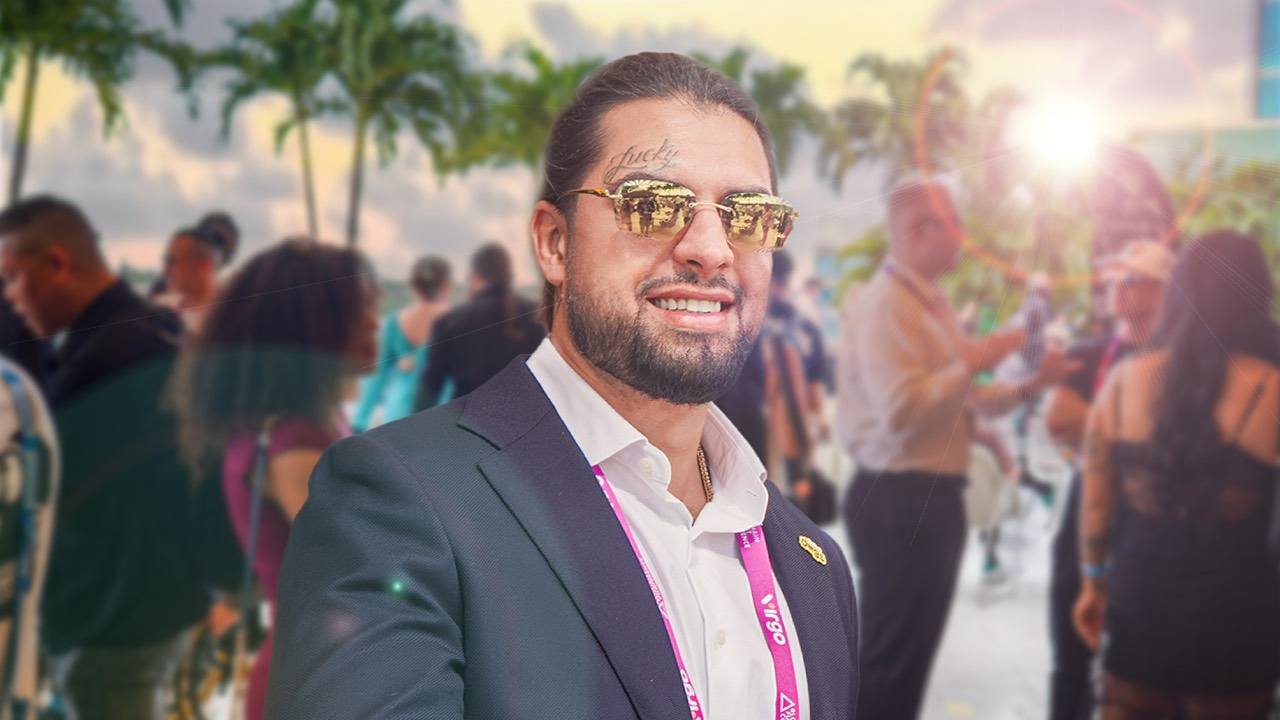David Chaboki (Shibo) in a navy suit at an outdoor crypto conference