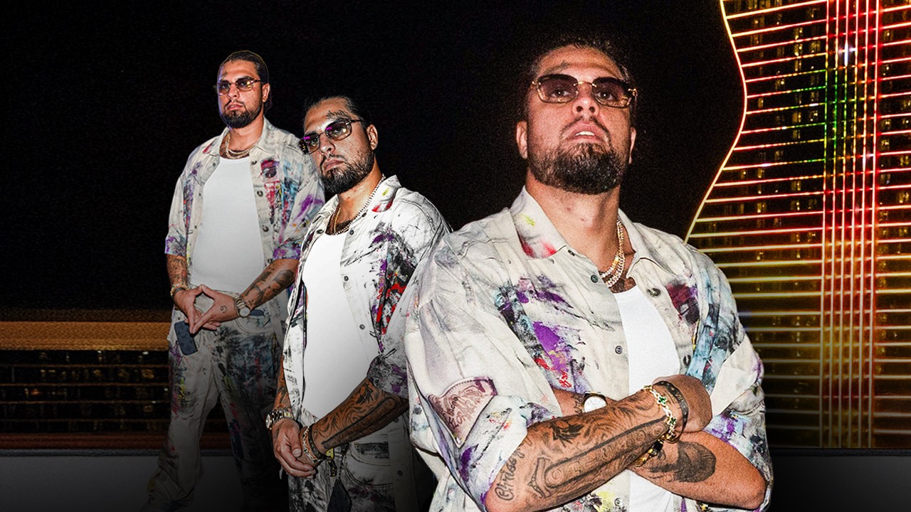 David Chaboki (Shibo) in a paint-splatter shirt at a Las Vegas crypto event